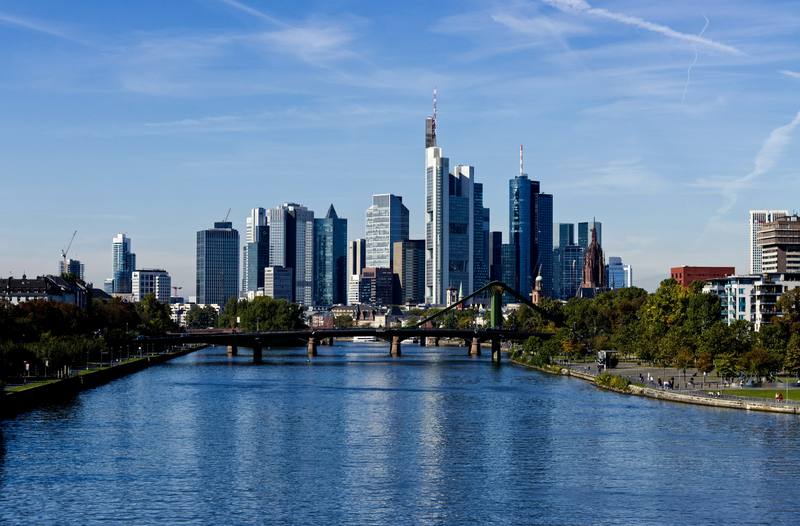 The Frankfurt skyline rising behind the river Main