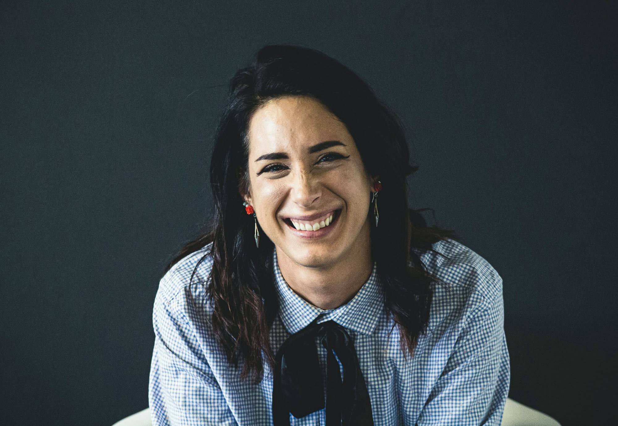 Portrait of a laughing woman in a blue shirt