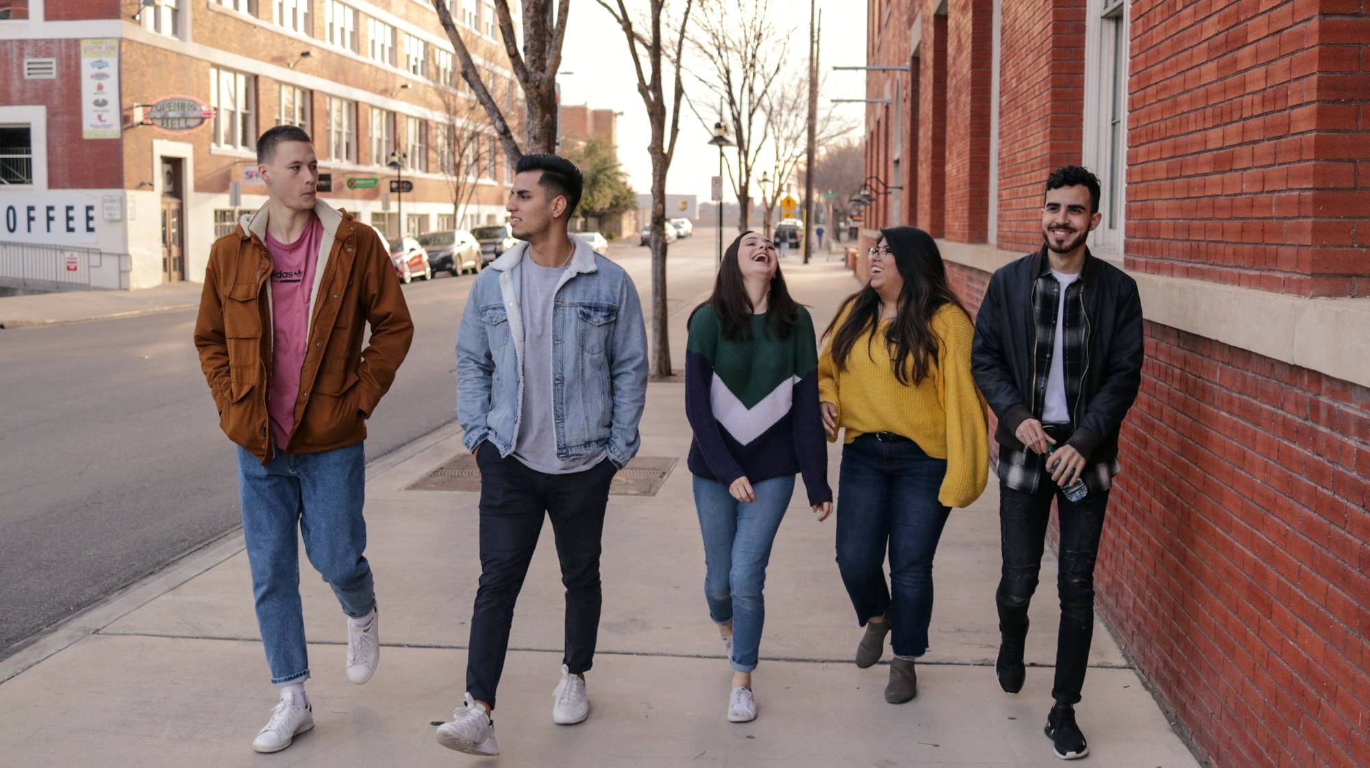 Students walking together across a sunny campus